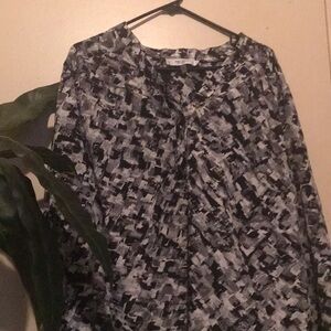 Black and white..silky feel..too long sleeve..runs a little small for a 2X..